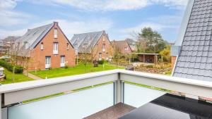 a view from the balcony of a row of houses at Hapimag Resort Dünenblick in Westerland