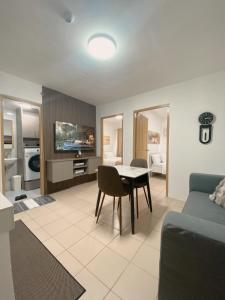 a living room with a table and a couch at AJA Suite in Davao City