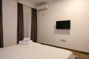 a hotel room with a bed with towels on it at Hotel Adria 2 Shengjin in Shëngjin