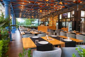 a dining room with wooden tables and chairs at Hotel Adria 2 Shengjin in Shëngjin +40 photos