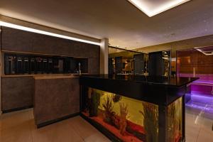 an aquarium in the lobby of a hotel at Aura Villas Skopje in Skopje