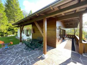 a pavilion with a table and chairs on a patio at Chalet Villa Josi Superior Appartement 12 in Leutasch
