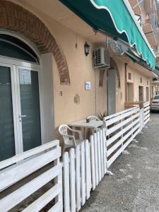 a table and chairs outside of a building at Home Ringo in Belvedere Marittimo