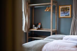 a bedroom with a bed and a book shelf at The Slow & Easy in Lostock Gralam +84 photos