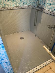 a shower floor in a shower stall in a bathroom at La maison dans les prés in Labaroche +11 photos