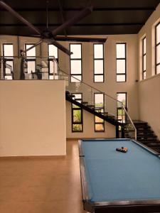 a pool table in a room with a ping pong ball at Silver Sand Resorts With Private Swimming Pool in Chennai