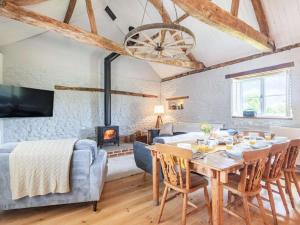 a living room with a dining table and a fireplace at 3 Bed in Kings Lynn oc-88223 in Beeston