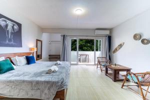 a bedroom with a bed with two teddy bears on it at Authentic Nest in La Gaulette