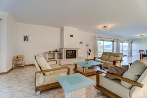 a living room with furniture and a fireplace at Lagos House in Braga