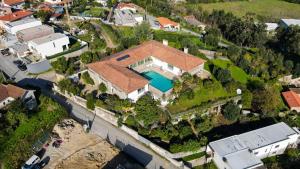 an overhead view of a house with a swimming pool at Lagos House in Braga