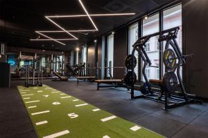 a gym with two treadmills and cardio machines at Radisson Blu Hotel Schwarzer Bock Wiesbaden in Wiesbaden