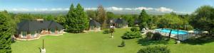 an aerial view of a house with a swimming pool at Solar Encantado Cabañas & Chalet in Villa General Belgrano