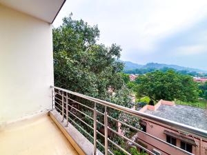 a balcony of a building with a view at Hotel Nirvana Palace Near Parmarth Niketan in Rishīkesh