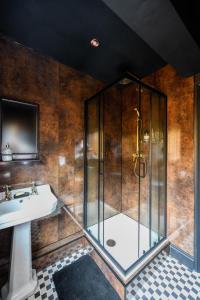 a bathroom with a shower and a sink at Bold Coastal Retreat with Boudoir Interiors, Felpham Village in Bognor Regis