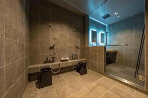 a large bathroom with a shower and a sink at Nui in Minamiawaji +21 photos