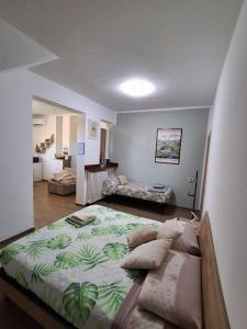 a bedroom with a large bed with pillows on it at Casa di Sara - Comfort, Privacy, Posizione in Zanica