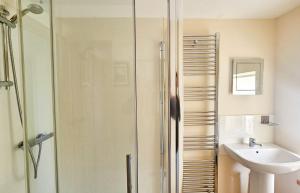 a bathroom with a shower and a sink at Ben Edra Croft in Staffin +31 photos