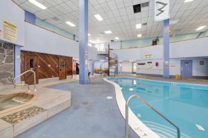 a large swimming pool in a building with a swimming pool at Beech Mountain Studio - Trails, Concerts & Bike Park in Beech Mountain