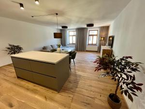 a living room with a couch and a table in it at Core Apartments Jihlava in Jihlava +73 photos