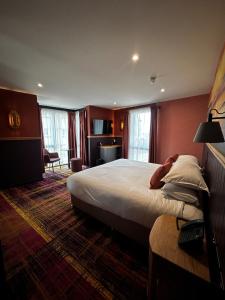 a hotel room with a bed and a desk at Albert Hotel in Kirkwall