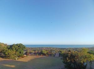 an aerial view of a park with the ocean in the background at Kaaimans Crest Ocean-View Studio in Great Brak River