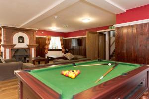 a living room with a pool table with balls on it at Secluded Seven Room House in Okehampton