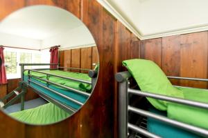 a mirror in a room with bunk beds at Secluded Seven Room House in Okehampton