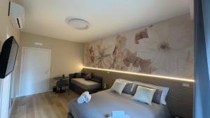a hotel room with a bed and a couch at Affittacamere Nonna Maria in Foggia