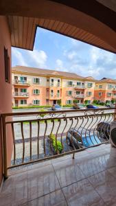 a balcony with a view of a building at The Vistana 4Bedroom Pearly Gate Estate Ikota VGC Lekki in Igboshere