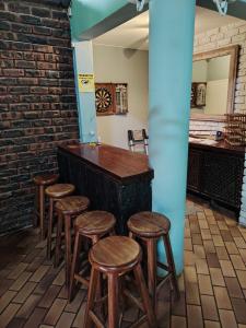 a row of stools in a room with a bar at Pennington Holiday Cottages in Pennington