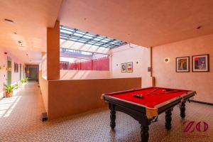 a pool table in a room with a skylight at Zo Selections Jaipur by Zostel in Jaipur