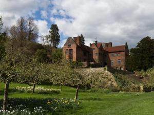 an old brick house on a hill with trees and grass at 2 Bed in Westerham oc-88626 in Westerham
