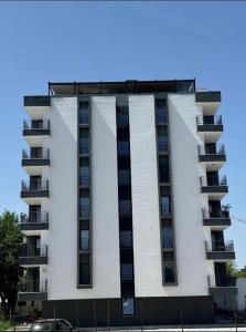 an apartment building with the letter m on it at Raul Studio in Saturn