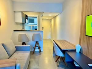 a living room with a couch and a table at Loft near Santa Casa - Apt 604 in Porto Alegre