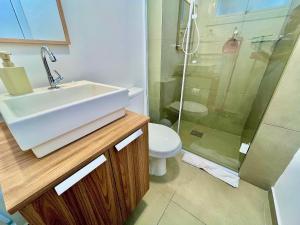 a bathroom with a sink and a shower and a toilet at Loft near Santa Casa - Apt 604 in Porto Alegre