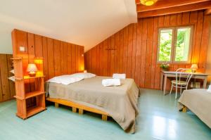 a bedroom with a bed and a desk in it at La beuillotte in Bar-sur-Seine