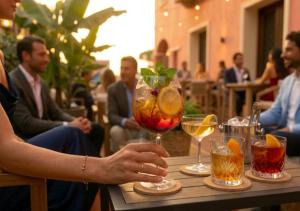 a person holding a wine glass on a table at La Vecchia Fonte Boutique Hotel in Palau