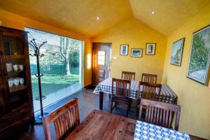 a dining room with a table and a window at Rooms Gašper 1 in Postojna
