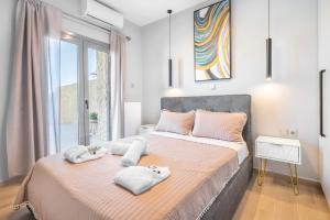 a bedroom with a large bed with towels on it at Azure Harmony Pool Villa by SEM in Áyios Spirídhon +37 photos