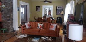 a living room with a couch and a table at Waterfront the Alcove in Duluth