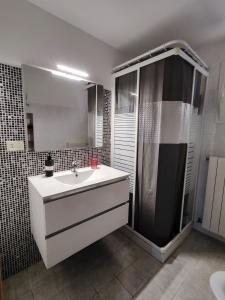 a bathroom with a white sink and a shower at B&B Palazzo Antonelli in Monopoli +44 photos