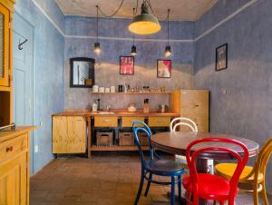 a dining room with a table and chairs at apartmán Port Arthur in Manětín