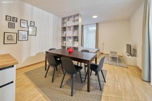 a kitchen and dining room with a table and chairs at Dolce Vita Harrachov in Harrachov