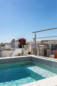 a swimming pool on the roof of a building at Casa Sala - Private Rooftop Swiming Pool in Olhão