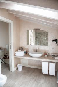 a bathroom with a sink and a mirror at B&B La Fiaba in Sirmione +66 photos