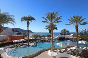 a resort with a pool and palm trees at Hotel Indigo La Paz Puerta Cortes by IHG in La Paz