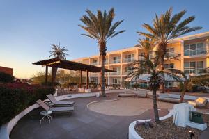 a resort with palm trees and a building at Hotel Indigo La Paz Puerta Cortes by IHG in La Paz