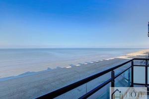 a view of the ocean from a balcony at Le Panoramique Marin- 2Ch in Bray-Dunes +4 photos