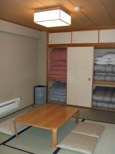 Postel nebo postele na pokoji v ubytování Sundance Resort Kawaguchiko