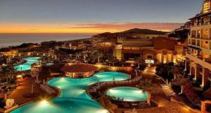 a view of a pool at a resort at night at Pueblo Bonito Sunset Beach Owners Exec Suite 1BR2B REQUEST DATE see Clay & Lisa in Cabo San Lucas